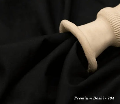 Black Premium Boski fabric 704 draped with beige ceramic vase on dark background